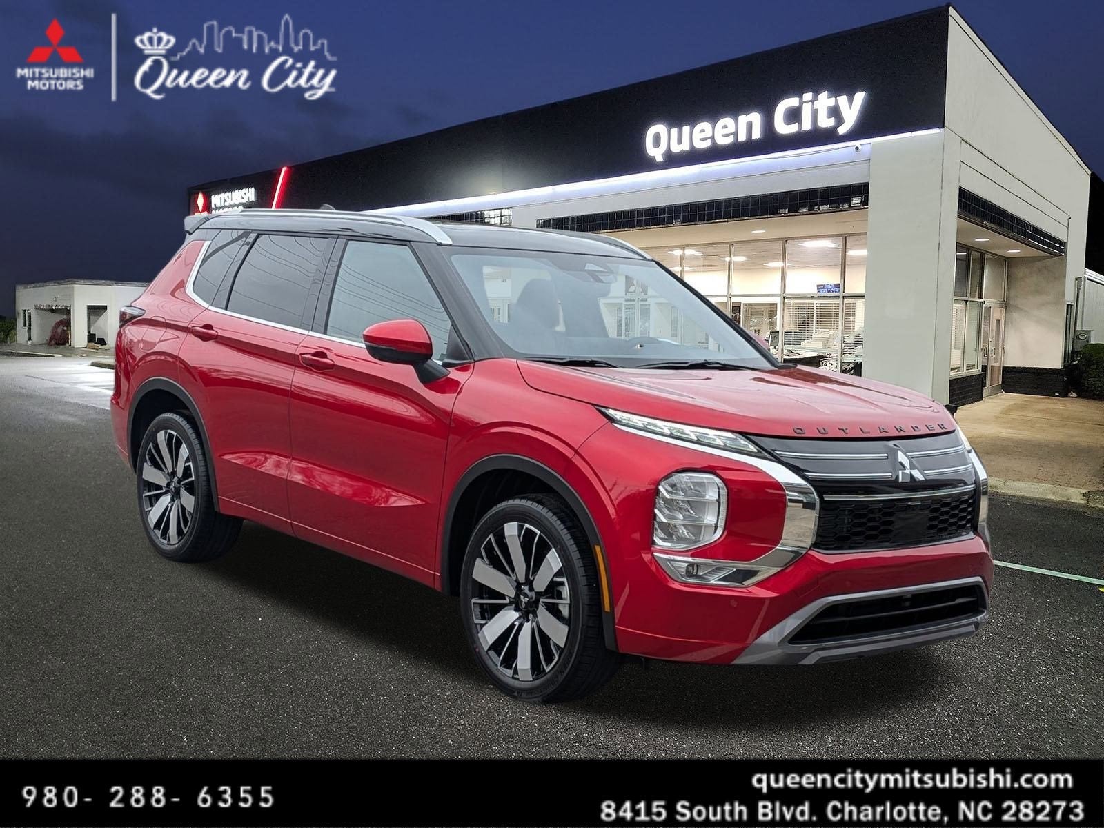 2026 Mitsubishi Outlander SEL in Red Diamond/Black Roof — front three-quarter view